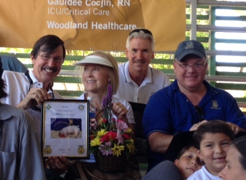 President Clyde & Krim Brooker along with Chuck Moore and Don Huff III at the FFA Auction at the Fair. Our Club provides financial support to be certain each participating student gets a fair price for their efforts. Clyde is holding a picture of a pig the Club purchased this year.